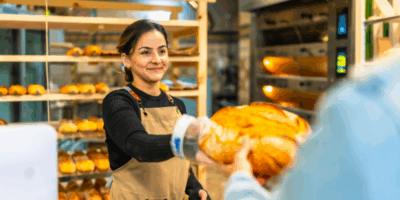 woman selling bread to a client in an artisan bake 2024 12 10 03 32 14 utc