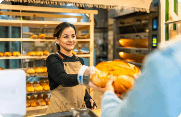 Как составить предложение, которое приведёт клиентов? 6 woman-selling-bread-to-a-client-in-an-artisan-bake-2024-12-10-03-32-14-utc